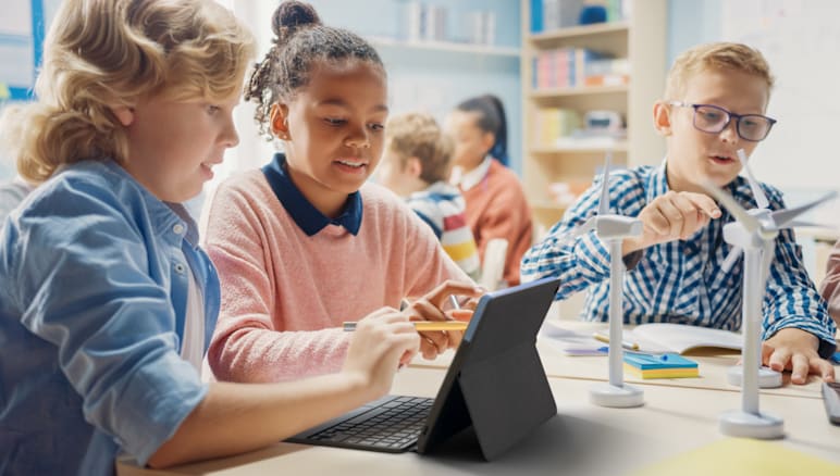 Kids using a digital pencil with tablet